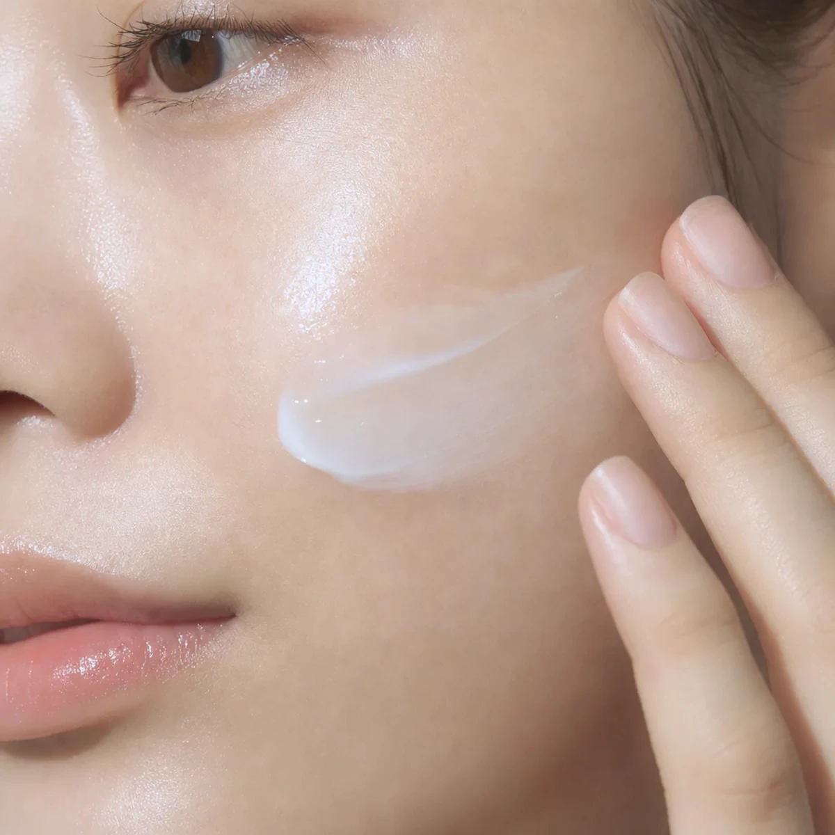 Close-up of moisturizer being applied to skin